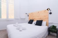 Posteľ alebo postele v izbe v ubytovaní 1840 Apartments Sitges by Suma Hotels