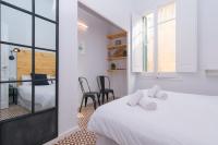 Posteľ alebo postele v izbe v ubytovaní 1840 Apartments Sitges by Suma Hotels