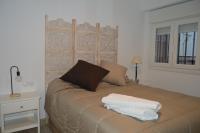 Posteľ alebo postele v izbe v ubytovaní ALCAZAR VIEJO SUITE Tourist Córdoba