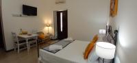 A bed or beds in a room at Il Rifugio Del Pirata