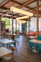 an empty cafeteria with tables and chairs at Apartamentos LIVVO Morromar in Puerto del Carmen