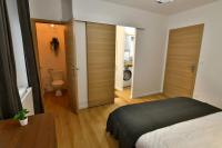 Łóżko lub łóżka w pokoju w obiekcie Le 46 - T2 rénové, confortable proche centre-ville