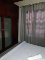 A bed or beds in a room at Niki House