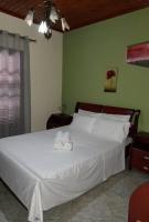 A bed or beds in a room at Niki House