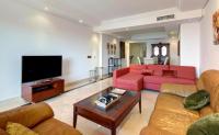 A television and/or entertainment centre at Estepona Mar Azul Aparthotel