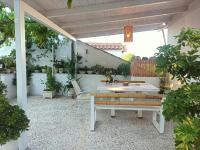 A garden outside Papadioti Apartments