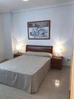 A bed or beds in a room at Apartamento a primera linea de playa ideal para relajarte - COSTA MARINA III