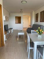 A seating area at Apartamento a primera linea de playa ideal para relajarte - COSTA MARINA III