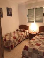A bed or beds in a room at Apartamento a primera linea de playa ideal para relajarte - COSTA MARINA III