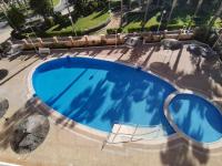 The swimming pool at or close to Apartamento a primera linea de playa ideal para relajarte - COSTA MARINA III