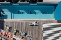 a woman laying in a swimming pool on a cruise ship at DINA MORGABINE SAINT DENIS in Saint-Denis