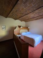 Posteľ alebo postele v izbe v ubytovaní Hotel Gattapone