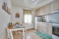 Kuchyň nebo kuchyňský kout v ubytování Ekavi Apartment