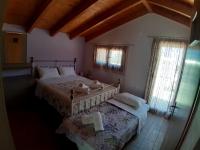 A bed or beds in a room at Traditional house in Akamatra square