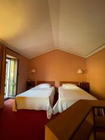 Posteľ alebo postele v izbe v ubytovaní Hotel Gattapone