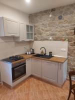 Kuchyň nebo kuchyňský kout v ubytování Holiday home Pepe