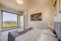 A bed or beds in a room at Villa Nikos Olivestone by Villa Plus