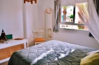 Posteľ alebo postele v izbe v ubytovaní Bamboo House