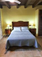 A bed or beds in a room at La Contrada