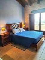 A bed or beds in a room at La Contrada