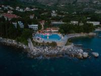 an aerial view of a swimming pool in the water at Aparthotel Plat in Mlini