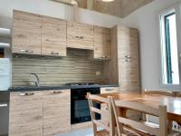 A kitchen or kitchenette at Chez Isabelle - Puglia Mia Apartments