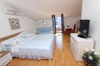 Posteľ alebo postele v izbe v ubytovaní Apartments Dujmović