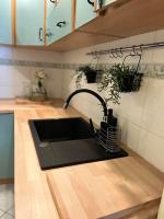 Kuchyňa alebo kuchynka v ubytovaní Przytulny Apartament
