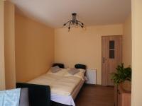 Posteľ alebo postele v izbe v ubytovaní Apartament Karamba