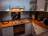 Kuchyňa alebo kuchynka v ubytovaní Apartament Wyszyńskiego Szczecin Polska