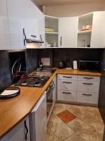 Kuchyňa alebo kuchynka v ubytovaní Apartament Wyszyńskiego Szczecin Polska