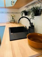 Kuchyňa alebo kuchynka v ubytovaní Przytulny Apartament