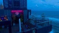 a restaurant on the beach at night at MaRadha Colombo in Colombo