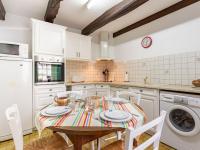 a kitchen with a table with plates and bowls on it at Holiday Home La Vallée by Interhome in Cancale