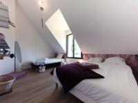 Łóżko lub łóżka w pokoju w obiekcie Holiday Home Le Rahic by Interhome