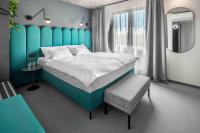 Postel nebo postele na pokoji v ubytování Boutique Hotel Mezi švy