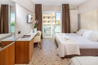 A bed or beds in a room at Hotel Royal