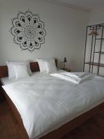Postel nebo postele na pokoji v ubytování PALAVIA Apartments