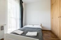 Posteľ alebo postele v izbe v ubytovaní Wagonowa P&O Apartments