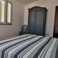 Łóżko lub łóżka w pokoju w obiekcie La casa di Alessia