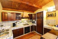 A kitchen or kitchenette at Holiday home with private pool, Solarino