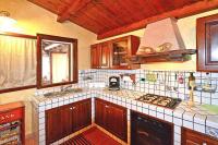 A kitchen or kitchenette at Holiday home with private pool, Solarino