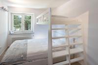 A bed or beds in a room at HelloChalet - Maison Rue de la Neige - Family Ski Holiday walking distance skirun and gondola