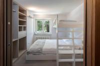 A bed or beds in a room at HelloChalet - Maison Rue de la Neige - Family Ski Holiday walking distance skirun and gondola