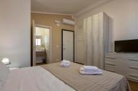 Posteľ alebo postele v izbe v ubytovaní Vico Rooms