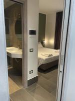 Posteľ alebo postele v izbe v ubytovaní Smart Rooms Naples