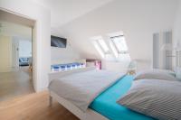 Łóżko lub łóżka w pokoju w obiekcie Apartament Holiday
