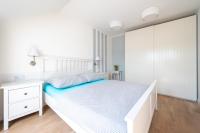 Łóżko lub łóżka w pokoju w obiekcie Apartament Holiday