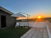 The sunrise or sunset as seen from a vendégházakat or nearby