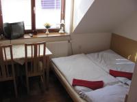 A bed or beds in a room at Chalupa LUKA Terchová